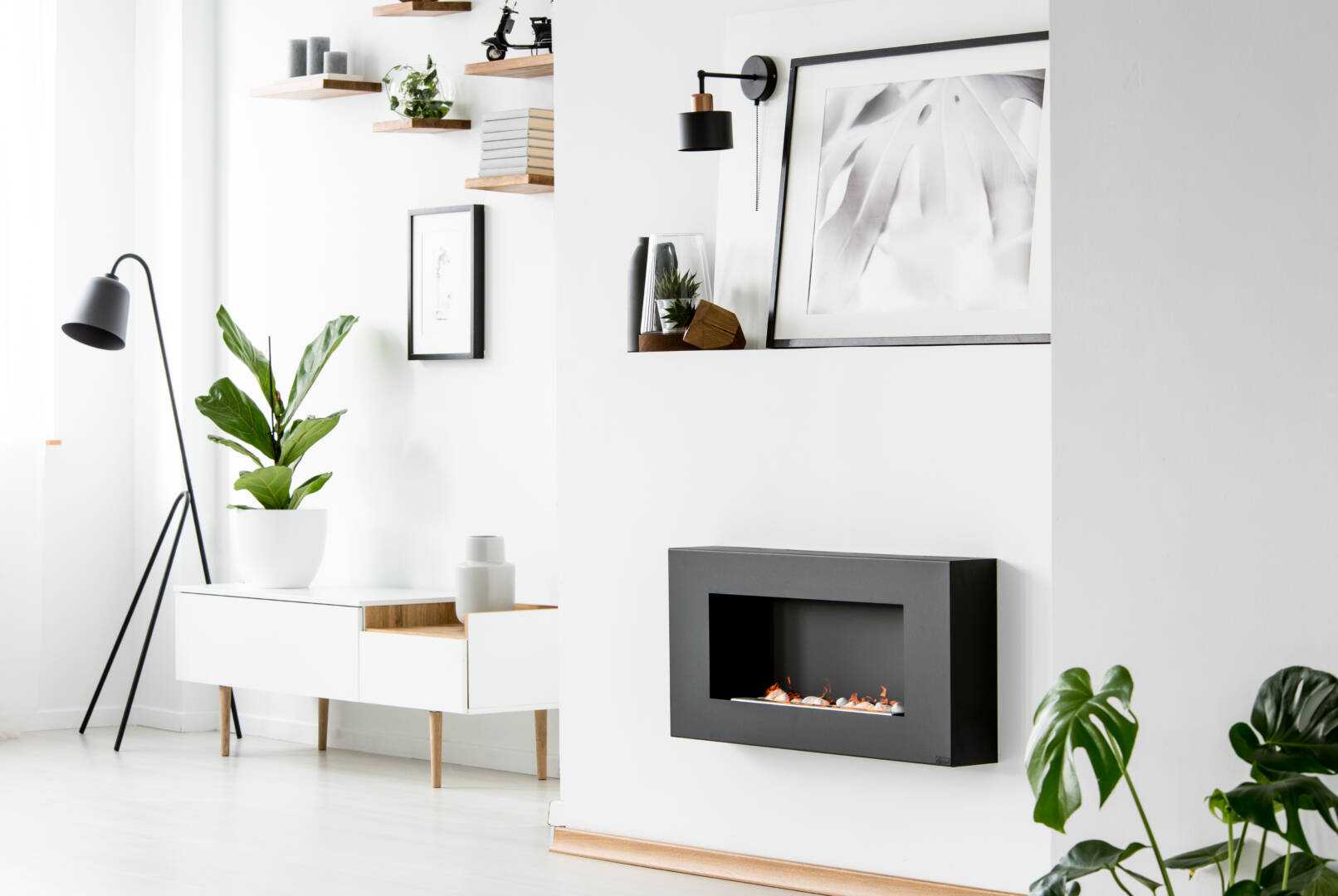 poster-above-black-fireplace-in-white-apartment-in-2021-08-26-15-45-38